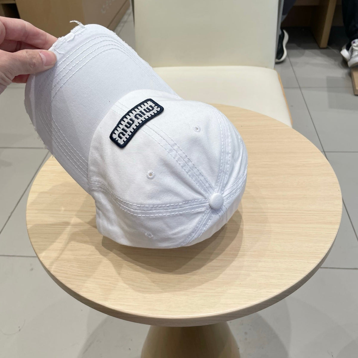 MIU MIU MM DISTRESSED FABRIC BASEBALL CAP IN WHITE WITH EMBROIDERED LOGO